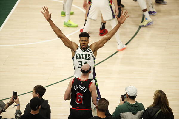 Giannis Antetokounmpo Art Print featuring the photograph Alex Caruso and Giannis Antetokounmpo by Jeff Haynes