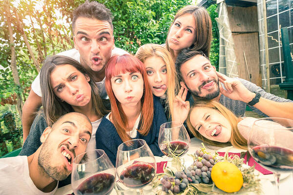 Young Men Art Print featuring the photograph Best friends taking selfie outdoor at winery tasting wine by ViewApart