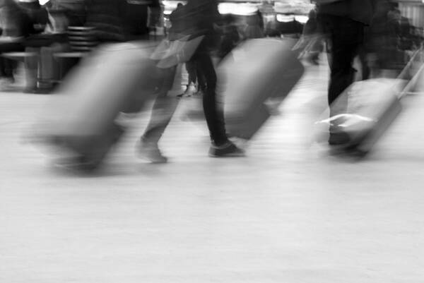 Crowd Of People Art Print featuring the photograph Blurred movement of Travellers with luggage by Lyn Holly Coorg