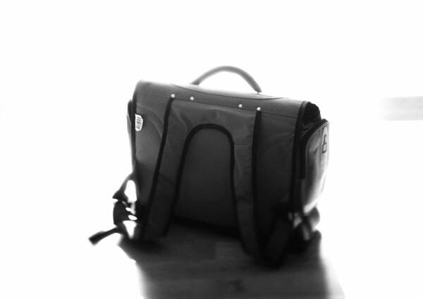 Single Object Art Print featuring the photograph Child's school bag, b&w. by Frederic Cirou
