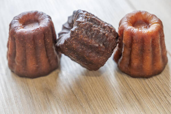 Unhealthy Eating Art Print featuring the photograph Close-up of canele cakes in a row by Ivan