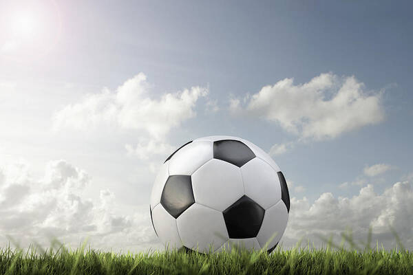 Grass Art Print featuring the photograph Close up of soccer ball in grass by Chris Clor