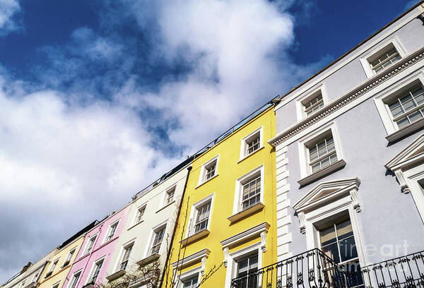 Houses Art Print featuring the photograph Colourful terraced townhouses with summer sky background and spa by Jane Rix