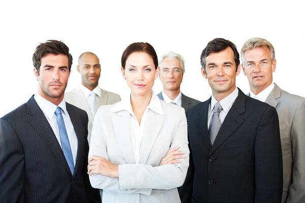 40-44 Years Art Print featuring the photograph Confident business colleagues standing together by GlobalStock