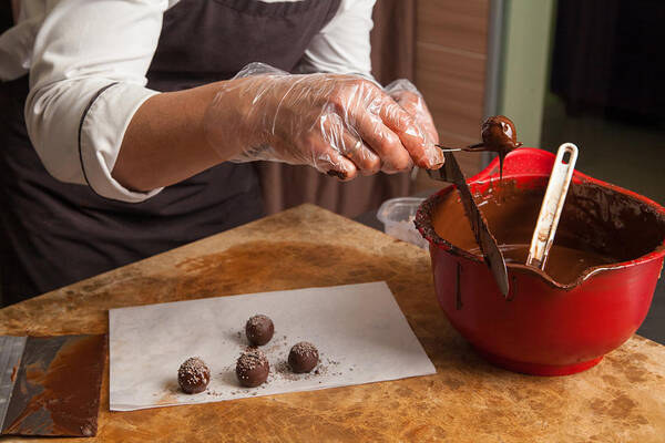 Working Art Print featuring the photograph Crop pastry chef preparing candies by Iuliia Isaieva