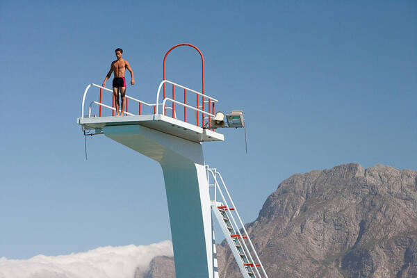 People Art Print featuring the photograph Diver standing on a diving board in a scenic location by Chris Ryan