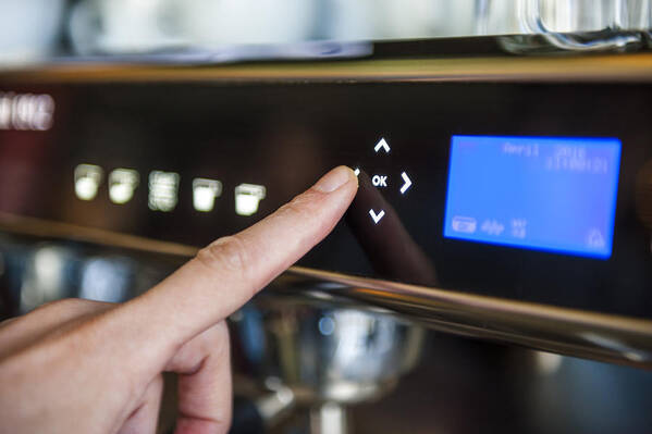 People Art Print featuring the photograph Finger pushing digital button on coffee machine by Westend61