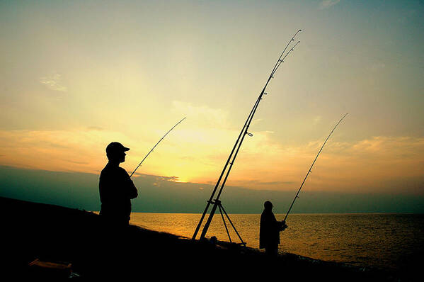Fishermen Art Print featuring the photograph Fishing at dusk. by Bill Lee