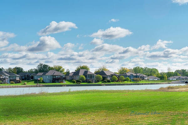 Clouds Art Print featuring the photograph House And Lake Lined Fairway by Ed Peterson