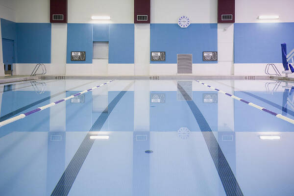Swimming Pool Art Print featuring the photograph Indoor swimming pool with lane markers by Andersen Ross