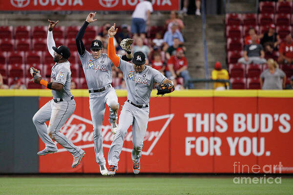 Great American Ball Park Art Print featuring the photograph Marcell Ozuna, Christian Yelich, and Giancarlo Stanton by Joe Robbins