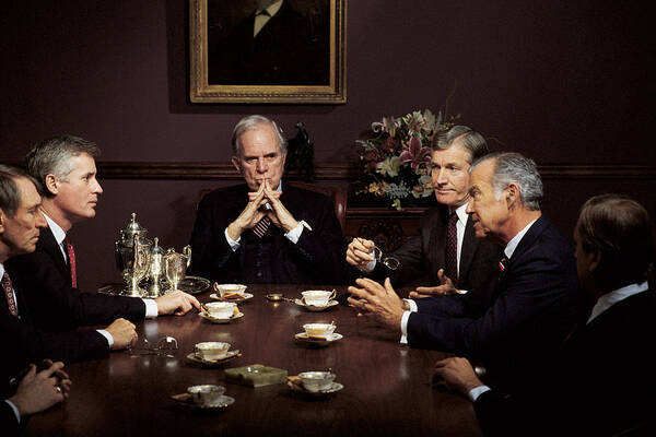 Mature Adult Art Print featuring the photograph Men in business meeting by Comstock