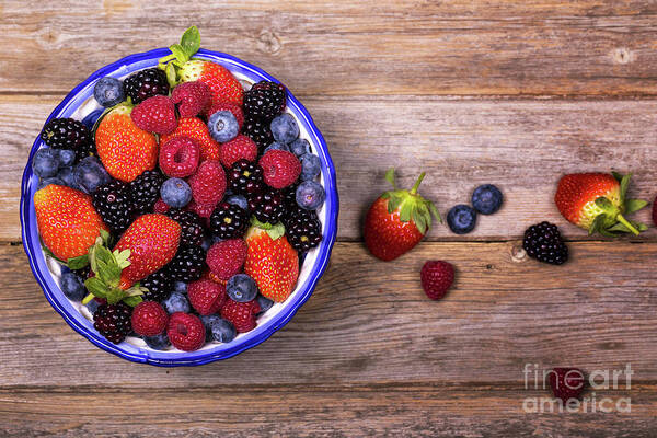 Background Art Print featuring the photograph Overhead view of summer fruits in a bowl by Jane Rix