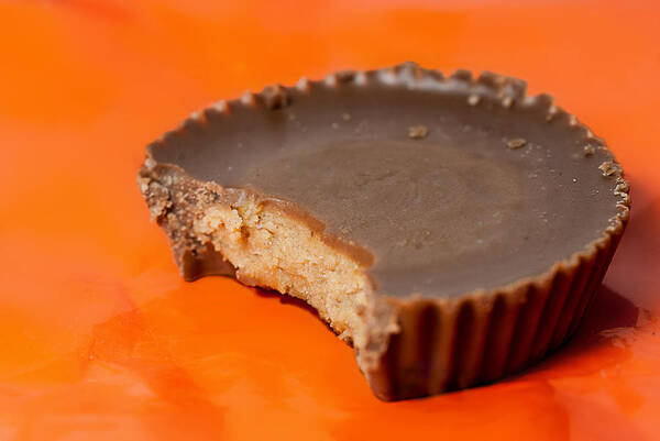 Horizontal Art Print featuring the photograph Peanut Butter Cup with Bite by Perry Gerenday