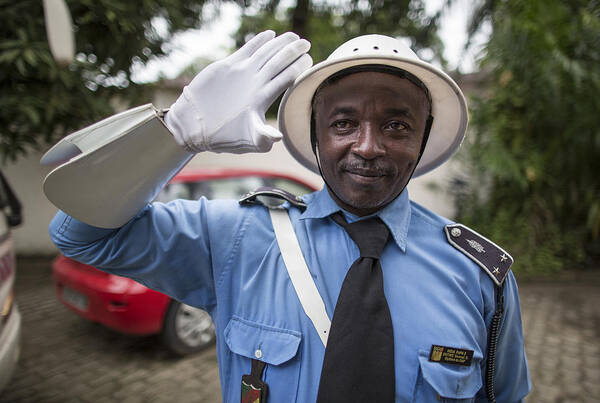 Douala Art Print featuring the photograph Policeman in Douala, Cameroon by Thomas Imo