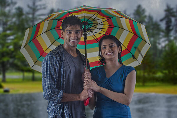 Young Men Art Print featuring the photograph Portrait of couple with umbrella by Abhinandita Mathur 