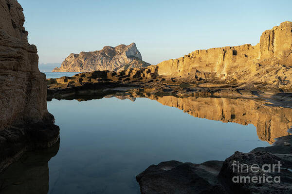 Mediterranean Art Print featuring the photograph Reflection of rocks in the calm Mediterranean Sea at sunrise 3 by Adriana Mueller