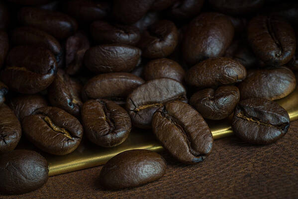 Breakfast Art Print featuring the photograph Roasted coffee beans over leather by Shaifulzamri