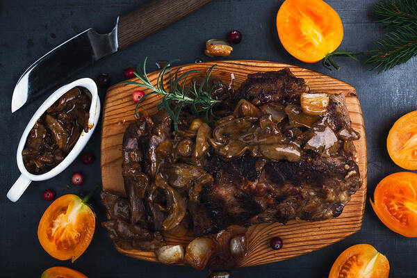 Tenderloin Art Print featuring the photograph Roasted veal steak on board served with mushroom sauce viewed from above, Christmas dinner by Istetiana