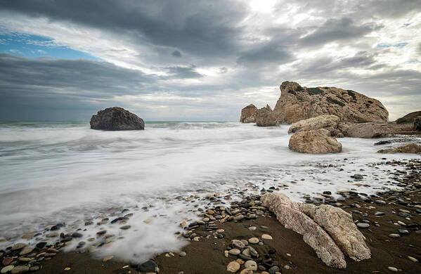 Seascape Art Print featuring the photograph Seascape with windy waves splashing at the rocky coastal area. by Michalakis Ppalis