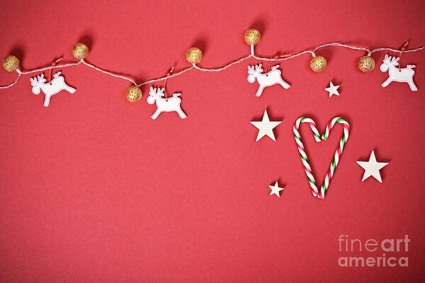 Seasonal Art Print featuring the photograph Seasonal greeting card concept with Christmas lights and candy cane heart by Mendelex Photography