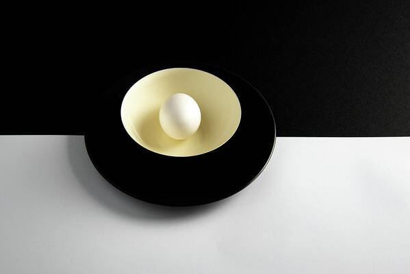 Still-life Art Print featuring the photograph Single fresh white egg on a yellow bowl by Michalakis Ppalis