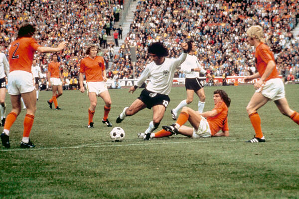 Scoring Art Print featuring the photograph Soccer - World Cup 1974 - final - West Germany v Holland by Peter Robinson - EMPICS