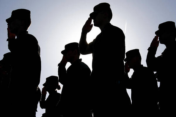 Toughness Art Print featuring the photograph Soldiers Salute the Flag at Sunset by Bwilking