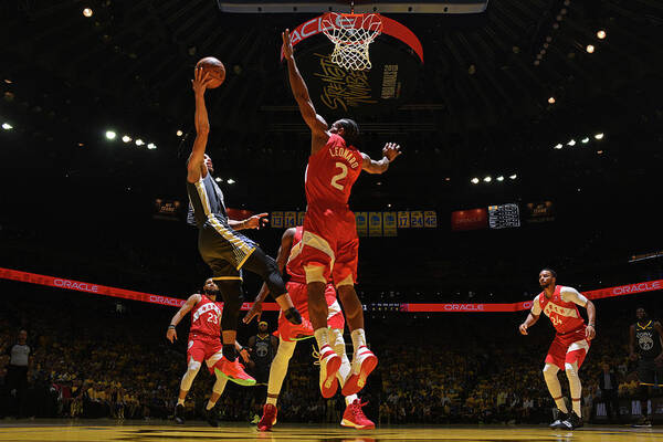 Stephen Curry Art Print featuring the photograph Stephen Curry and Kawhi Leonard by Garrett Ellwood