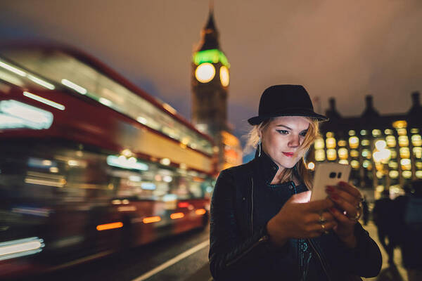 Leather Art Print featuring the photograph Teenage girl in London texting by night by Martin-dm