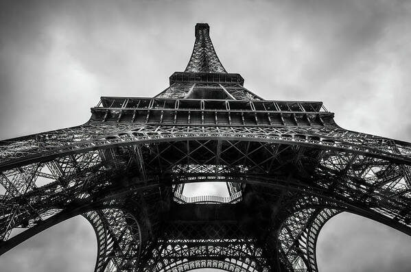 Eiffel Tower Art Print featuring the photograph The Eiffel Tower in Paris France Seen From Below in Black and White by Alexios Ntounas