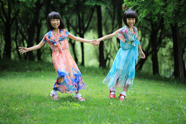 Sibling Art Print featuring the photograph The twin sisters dance in the woods by Bin Cai