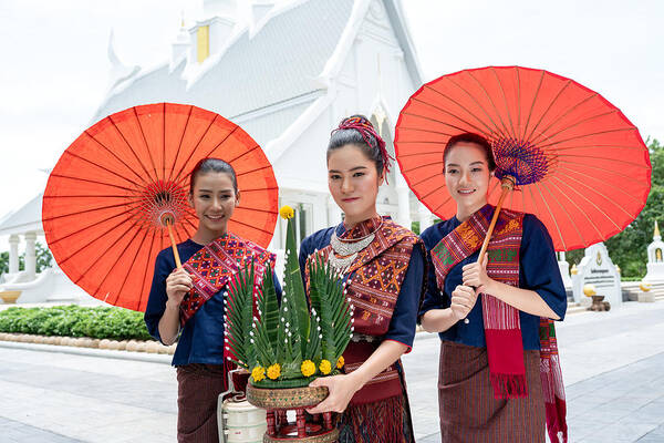 People Art Print featuring the photograph Three Thai girls dressed in traditional Isan traditional dress to go to the temple. by Sutiporn Somnam