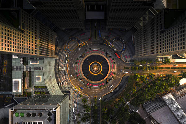 Downtown District Art Print featuring the photograph Top view of the Singapore landmark financial business district with skyscraper. Fountain of Wealth at Suntec city in Singapore by Ratnakorn Piyasirisorost