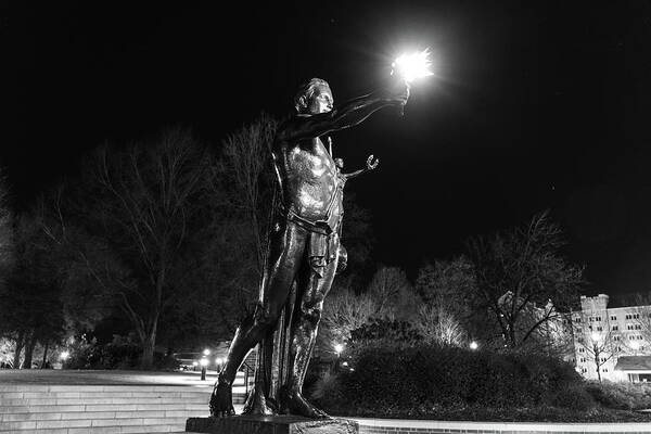 University Of Tennessee At Night Art Print featuring the photograph Torchbearer statue at the University of Tennessee at night in black and white by Eldon McGraw