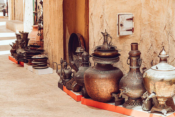 Arabia Art Print featuring the photograph Traditional Arab copper utensils for sale in Dubai by Kolderal