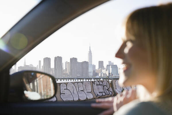 Car Interior Art Print featuring the photograph USA, Brooklyn, Williamsburg, Woman driving through city by Jamie Grill