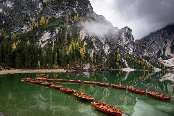 Lago Di Braies Art Print featuring the photograph Wooden boats on the peaceful lake. Lago di braies, Italy by Michalakis Ppalis
