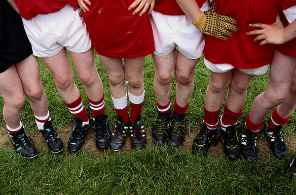 Child Art Print featuring the photograph Young Soccer Players Legs by Grant Faint