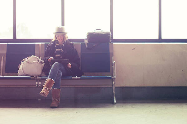 Airport Art Print featuring the photograph Young woman waiting in airport by © Lisa Kimberly