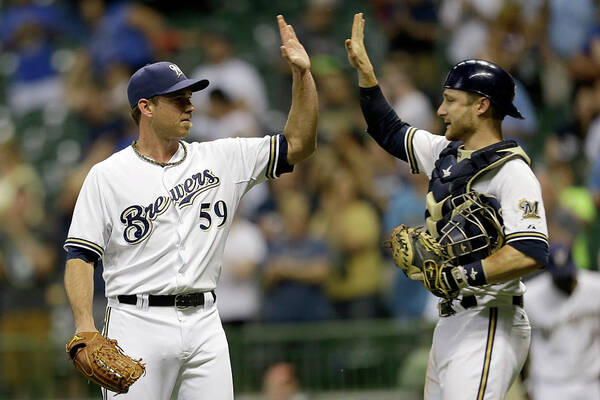 American League Baseball Art Print featuring the photograph Zach Duke and Jonathan Lucroy by Mike Mcginnis