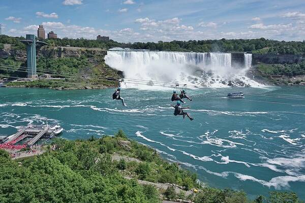 People Art Print featuring the photograph Ziplining by Niagara Falls, a new attraction for thrill seekers, a fun way to experience the natural wonder by Jana Kriz