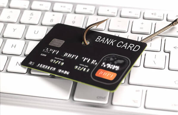 Financial Figures Art Print featuring the photograph Phishing credit card for information by Peter Dazeley