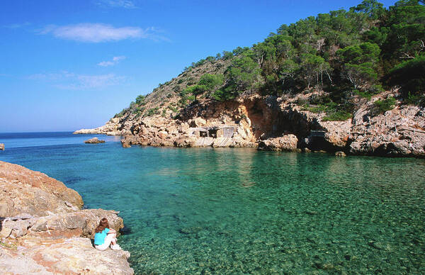 Shadow Art Print featuring the photograph Waters Of Cala Xucla With Girl On Rocks by David C Tomlinson