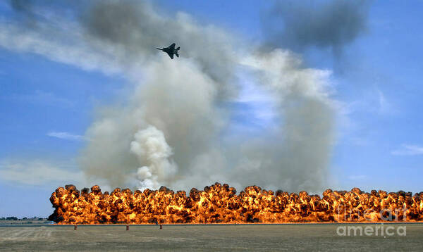 Air-to-ground Art Print featuring the photograph Pyrotechnics Explode While An F-15 by Stocktrek Images