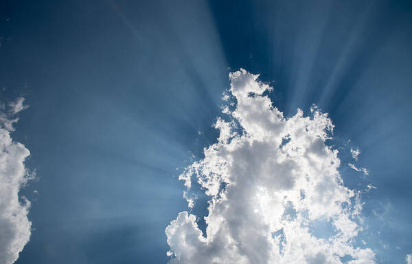 Atmosphere Art Print featuring the photograph Blue sky with white clouds and sun rays by Michalakis Ppalis
