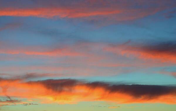 Clouds Art Print featuring the photograph Sunset Clouds In Blue Sky by Lyle Crump