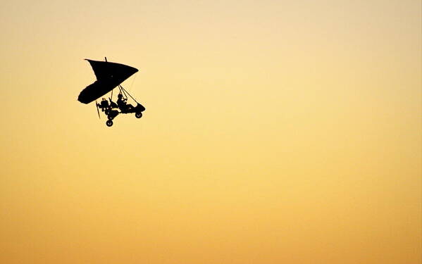 Sunset Art Print featuring the photograph Those Magnificent Men in Their Flying Machines by AJ Schibig