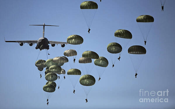 Parachutist Art Print featuring the photograph U.s. Army Paratroopers Jumping by Stocktrek Images