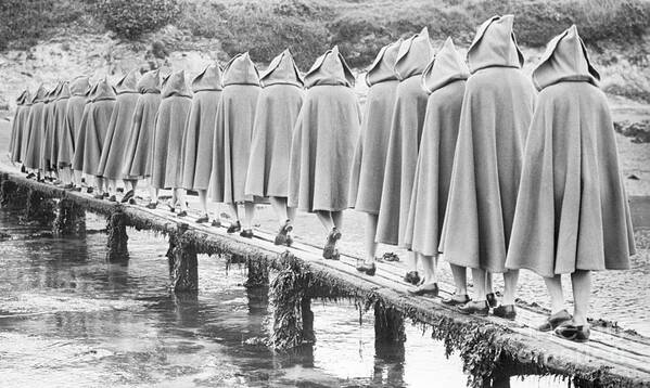 Child Art Print featuring the photograph Girls In Hoods And Capes Along A Pier by Bettmann